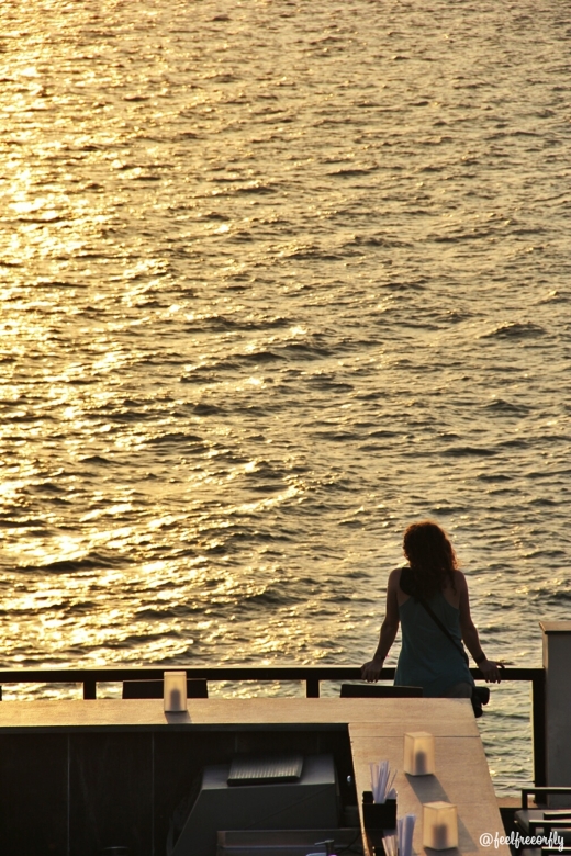 Inma (aworldtotravel.com) doing what she loves the most; enjoying the sunset. Location: The Leela Kovalam.